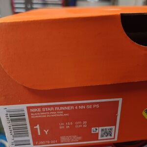 Nike Star Runner 4 in Black, White, and Pink 1Y